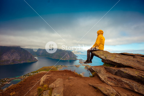 Tourist Enjoying Scenic View In Lofoten, Norway